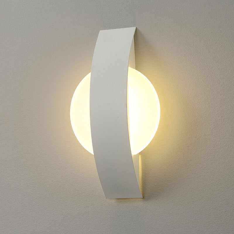 Sleek LED wall light emits a soft circular glow, perfect for modern minimalist interiors.