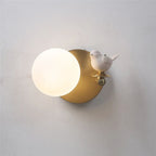 Brighten your space with this frosted glass LED wall light and brass accents.