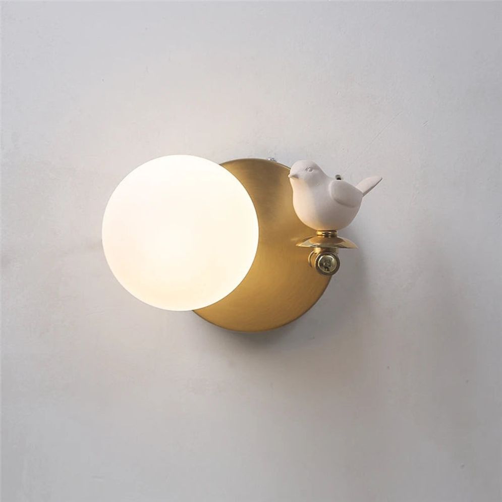 Brighten your space with this frosted glass LED wall light and brass accents.