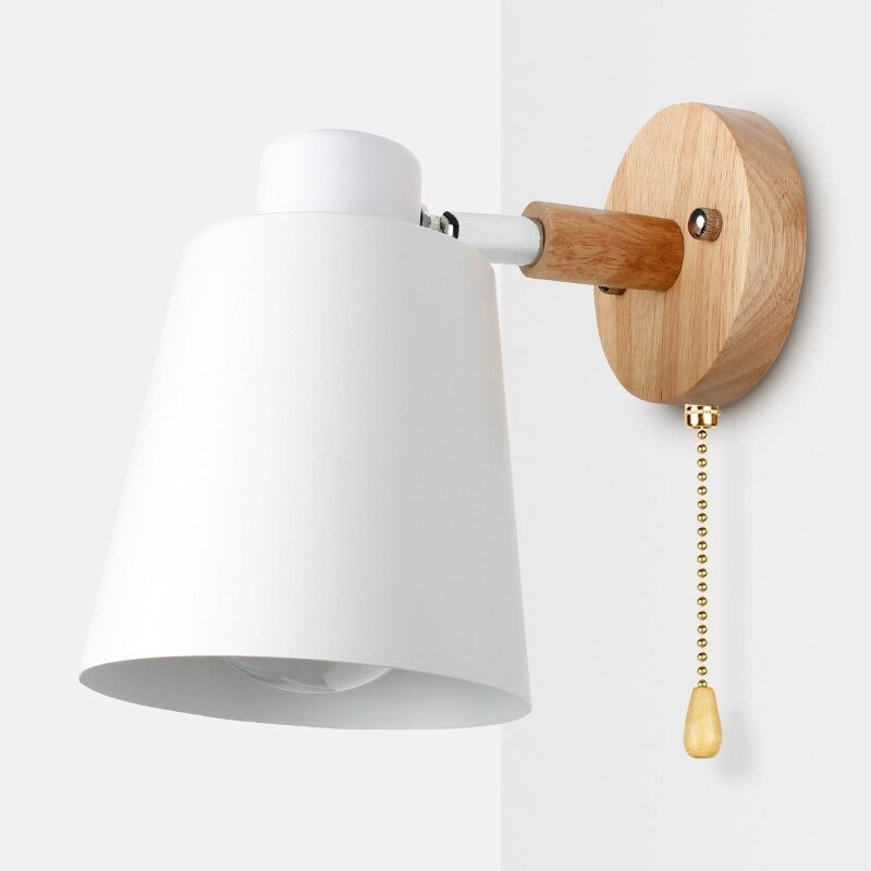 Brighten your room with soft, focused light from this stylish wood and brass wall lamp.