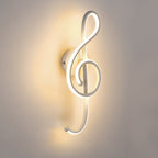 Glowing treble clef LED wall light emits a warm, elegant ambient glow.