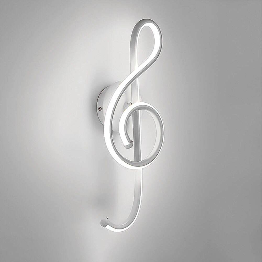 Glowing treble clef wall light radiates soft, modern lighting with minimalist appeal.