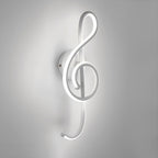 Glowing treble clef wall light radiates soft, modern lighting with minimalist appeal.
