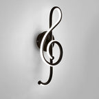 A glowing treble clef LED wall light adds unique, modern flair to any space.