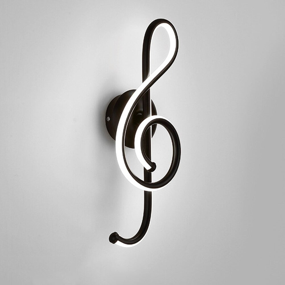 A glowing treble clef LED wall light adds unique, modern flair to any space.