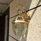 Sunlight enhances the golden copper wall light’s glow, casting radiant, sparkling illumination.