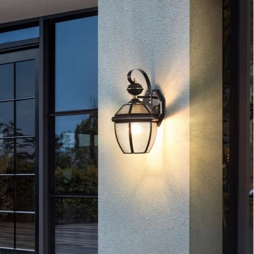 Warm dusk glow radiates outward, rays and reflections highlight exceptional wall lighting performance.
