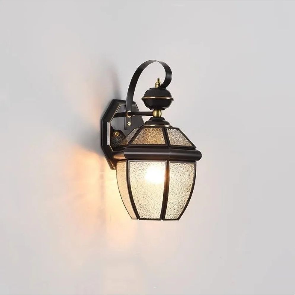 Classic black wall light with curved arm and glowing bulb, illuminating any indoor or outdoor space.