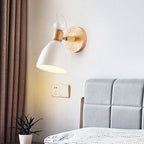 The Scandinavian wall light’s white shade provides soft, adjustable illumination for relaxing evenings.