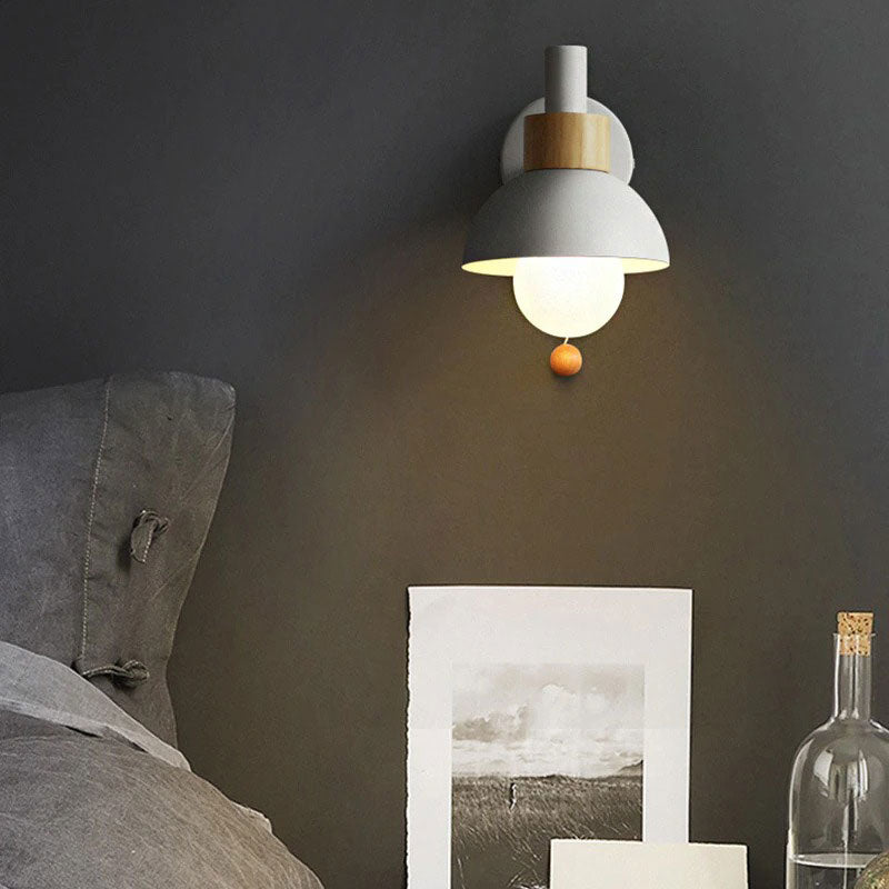 Warm white and wood wall light casts a soft, inviting glow in the room.