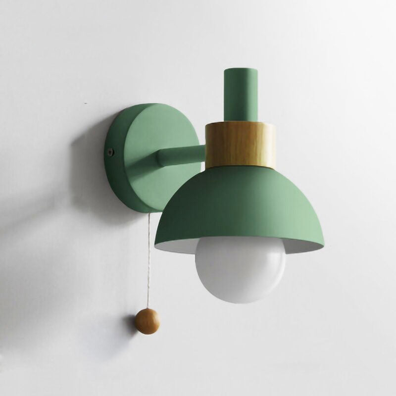 Matte green shade, wooden accent, and pull switch give soft retro lighting charm.