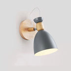 Experience warm, focused illumination with this adjustable Scandinavian-style wood and matte gray wall light.