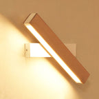 Warm LED light glows softly, creating adjustable modern illumination for any bedroom wall.