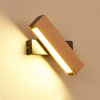 Warm yellow LED lighting shines from a sleek, adjustable rectangular wall fixture.