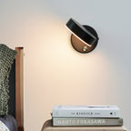 The Minimalist Round LED Wall Light casts a warm, modern glow in the space.
