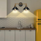 The space glows beneath ORLUNE HOME’s vintage double head wall sconce with metal shades.
