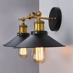 Brass and black vintage wall light with exposed Edison bulbs delivers bold industrial illumination.