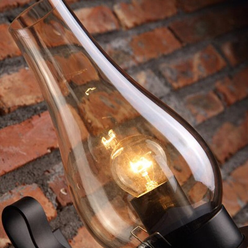 Warm glow from the vintage glass wall light creates a cozy, inviting ambiance.