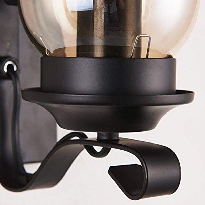 Soft, vintage globe light with glass shade and curved black arm, beautifully illuminates.