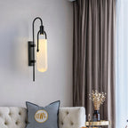 The ORLUNE HOME Estane LED sconce with frosted glass shade emits a soft, cozy glow.