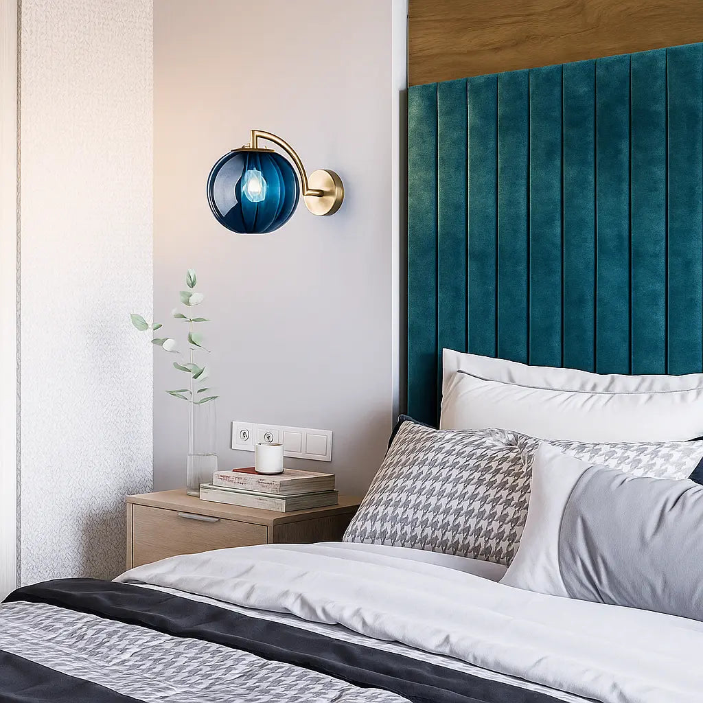 Warm light glows from the Retro Chic Brass Wall Light with Glass Globe above.