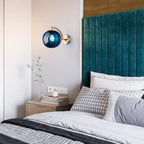 Warm light glows from the Retro Chic Brass Wall Light with Glass Globe above.