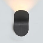 Warm upward LED accent lighting creates a sleek, contemporary glow against the white wall.