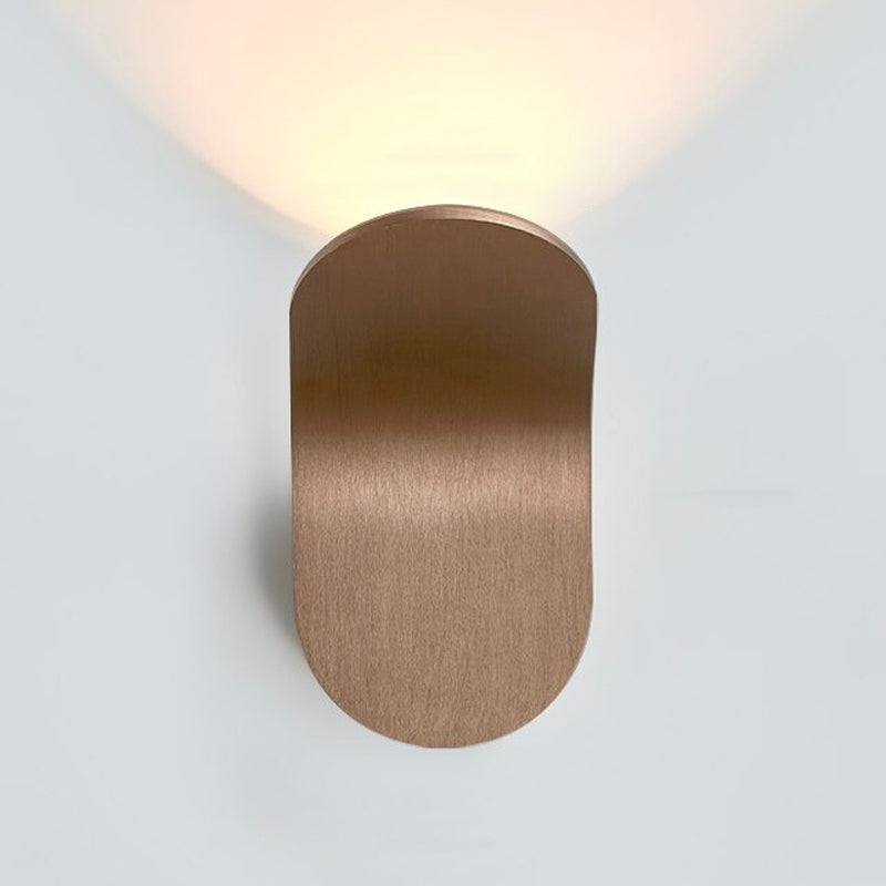 Soft upward accent lighting creates a warm, modern glow on the white wall surface.