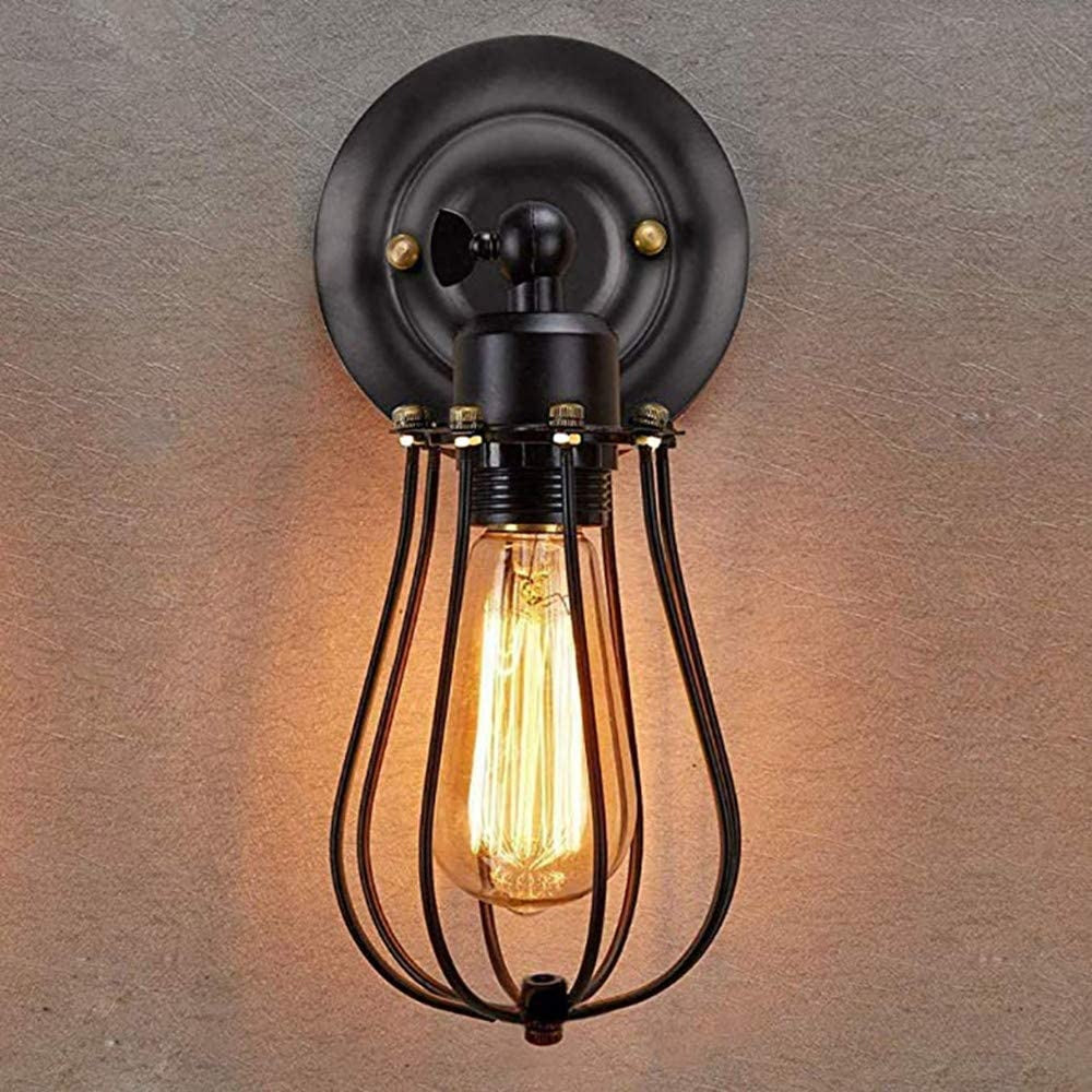 Edison bulb in black cage casts warm, soft, vintage-industrial lighting ambience.