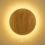 Soft, warm yellow backlighting forms a radiant halo for gentle wall illumination.