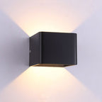 Soft LED up-and-down lighting creates elegant decorative patterns on white walls.