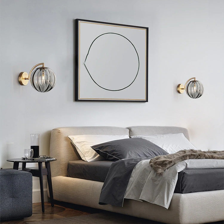 ORLUNE HOME Smoked Glass Ball Wall Lights create a modern, ambient glow above the bed.