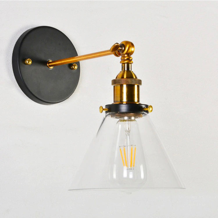 This light’s clear cone shade and gold socket showcase bright, stylish illumination.