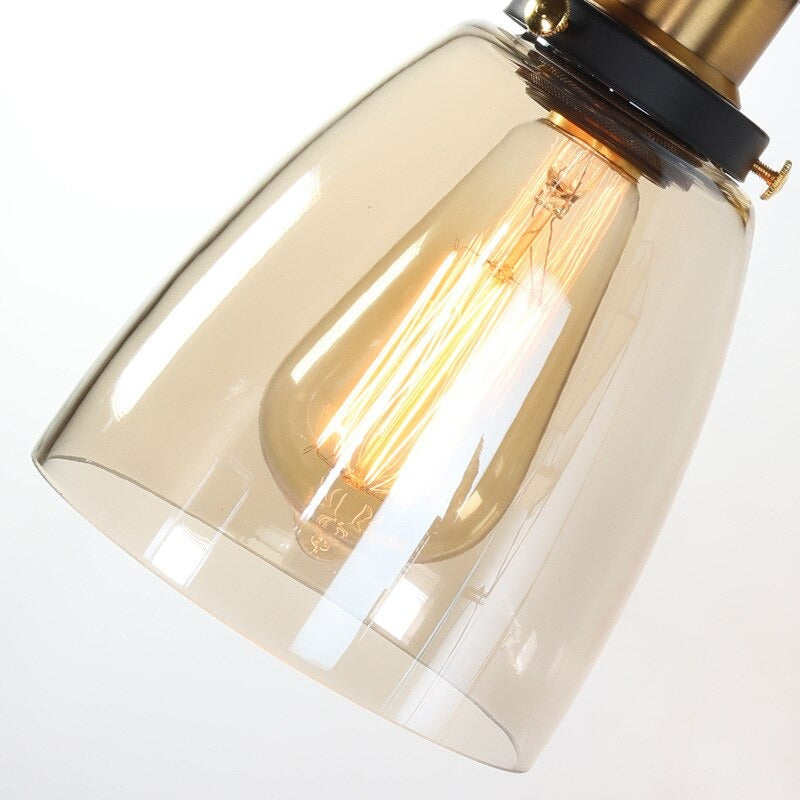 Vintage bulb light glows warmly inside transparent glass, creating elegant illumination for staircases.