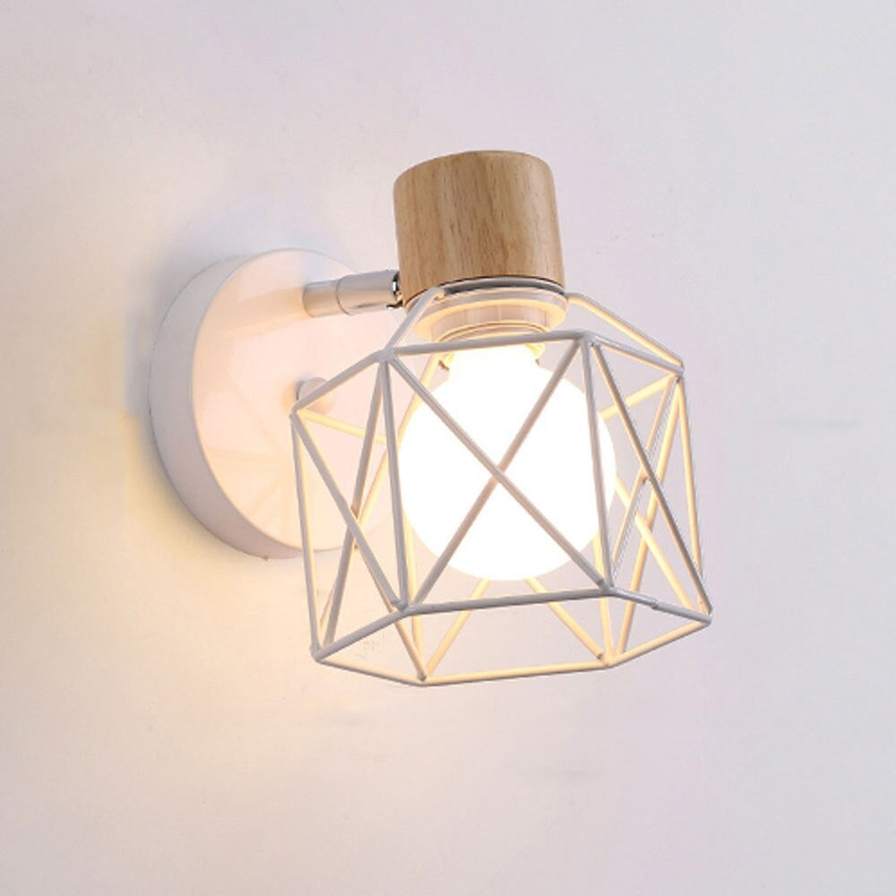 Experience elegant illumination with this glowing bulb encased in a geometric white cage sconce.