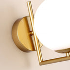 Warm gold and white globe wall light adds elegant, modern illumination to any space.