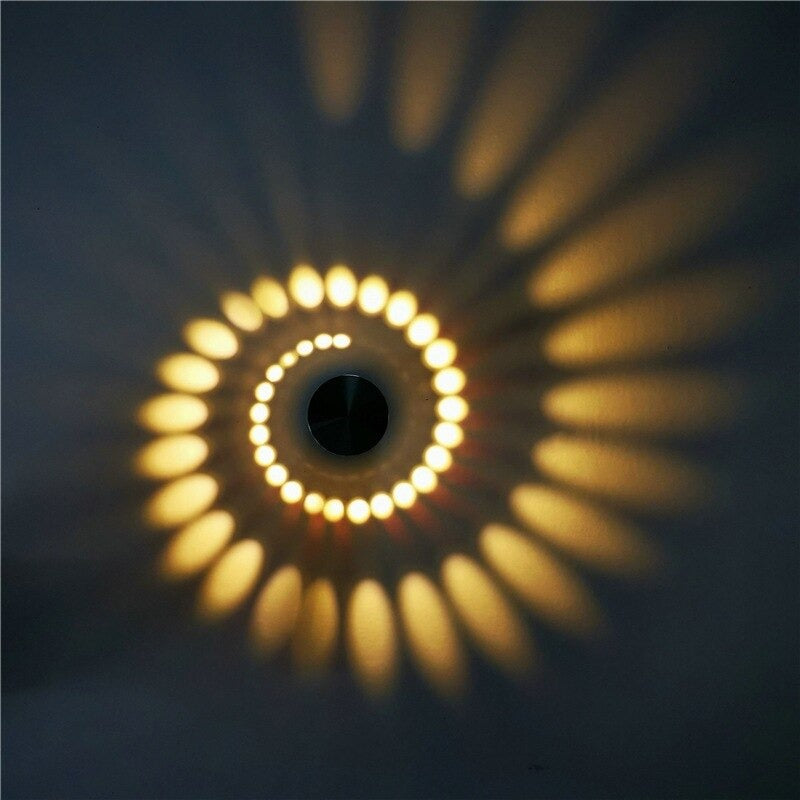 Warm yellow dots and rays from Spiral LED Wall Light create dynamic, artistic illumination.