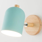 Modern wall light with pale blue shade and wood accents for bright, stylish illumination.