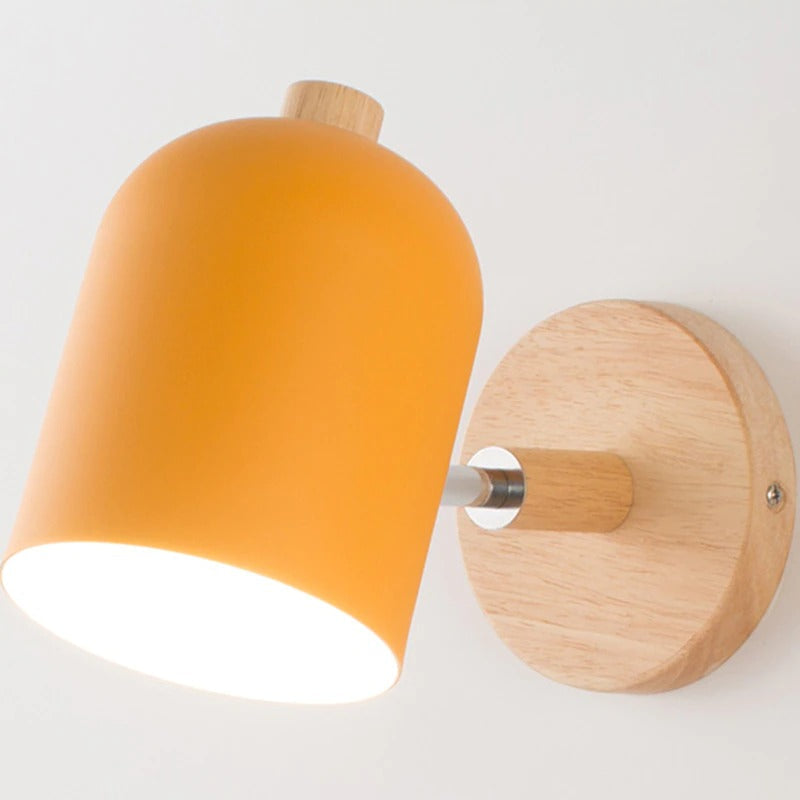 Bright white accent lighting shines from this minimalist wall lamp’s orange and wood design.