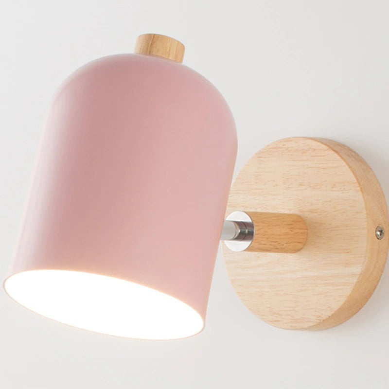 Soft white glow gently radiates from a matte pink shade for warm, modern illumination.