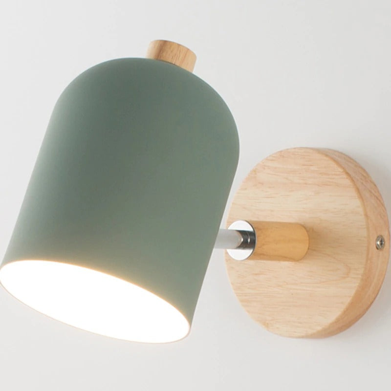 Soft glow radiates from matte green shade, enhancing any modern kitchen with gentle lighting.