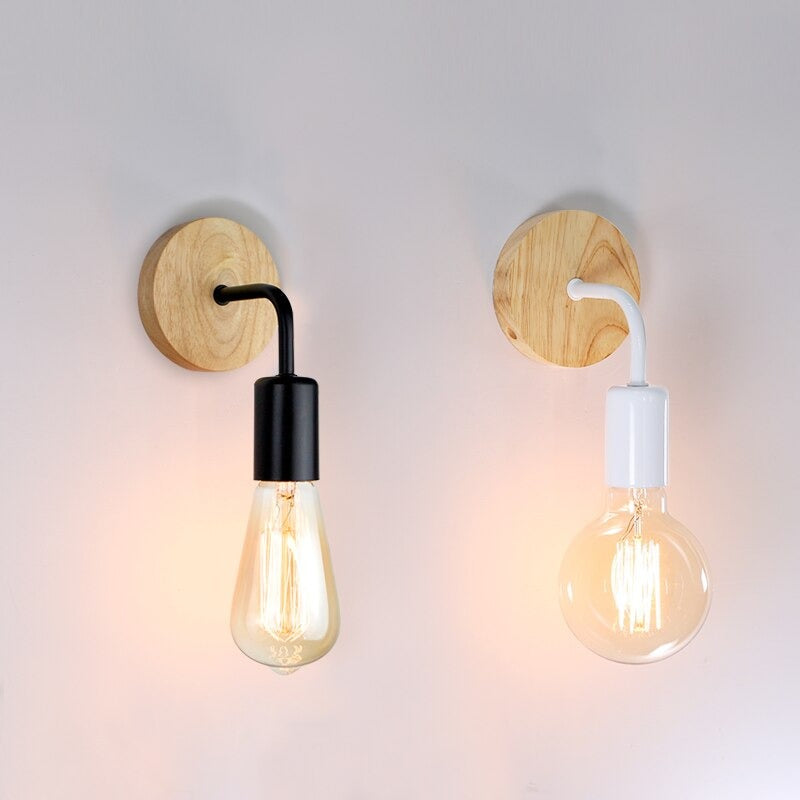 Warm, inviting light glows from teardrop and round bulbs in striking wall sconces.
