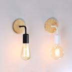 Warm, inviting light glows from teardrop and round bulbs in striking wall sconces.
