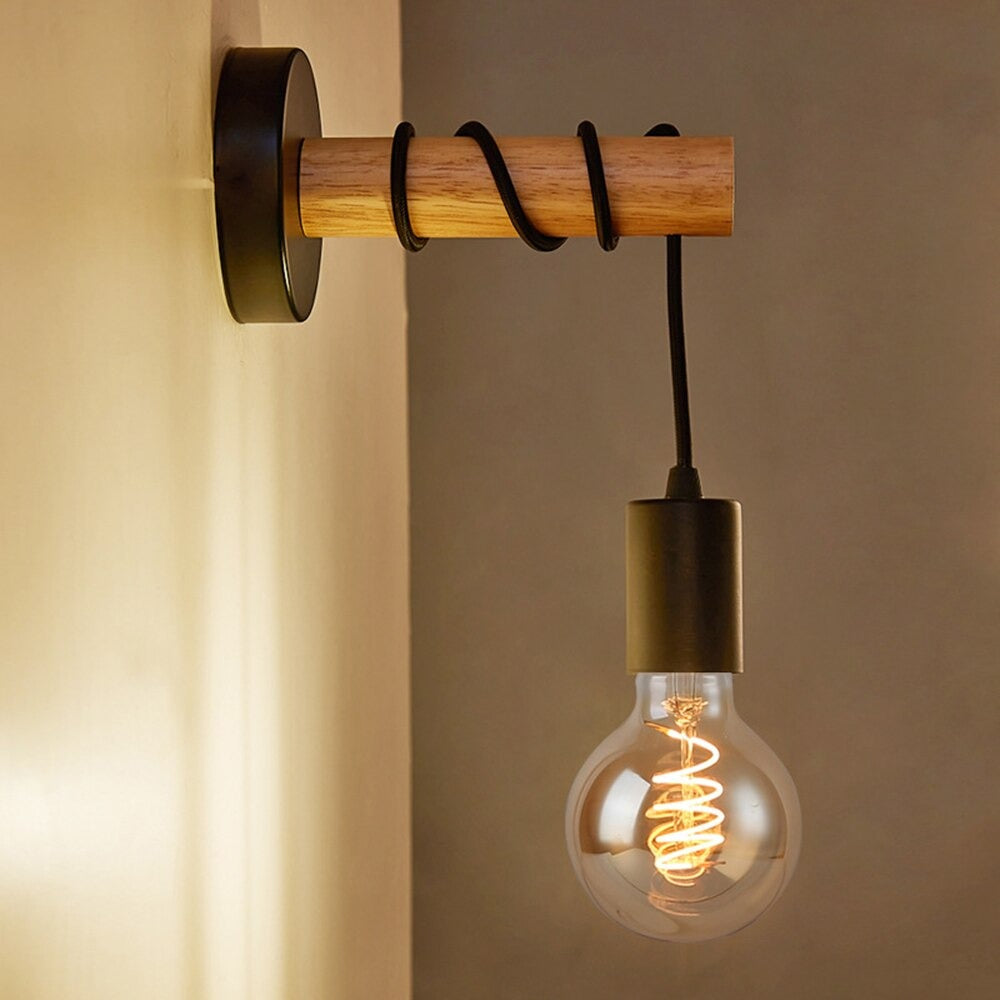 Experience warm, industrial-inspired lighting with an exposed filament bulb and black cord.