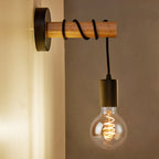 Experience warm, industrial-inspired lighting with an exposed filament bulb and black cord.