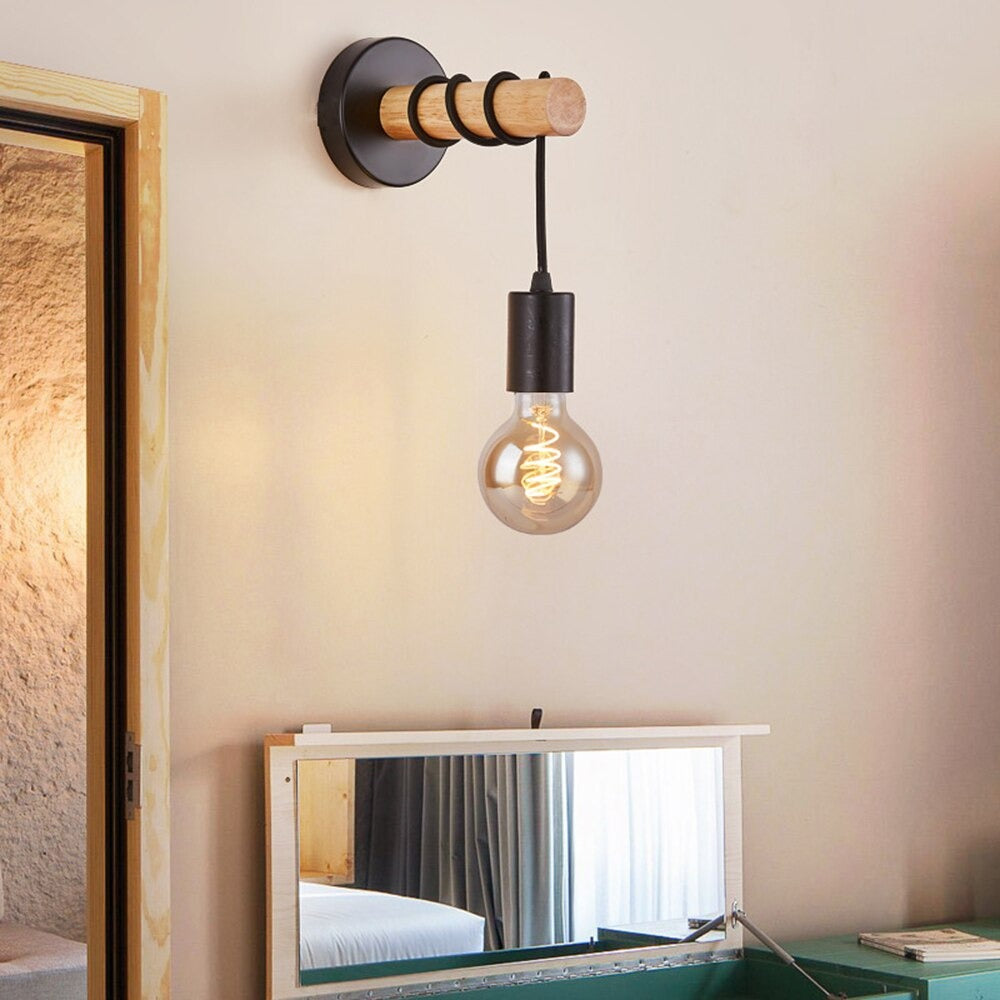 Experience focused, modern illumination with this sleek black and wood wall light fixture.