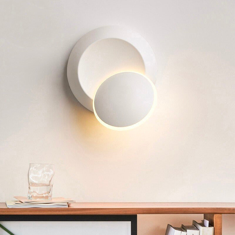 This minimalist LED wall light emits a gentle, modern, warm radiance for any room.