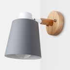 Soft, modern lighting with rotatable wood base and cone shade brightens your home perfectly.