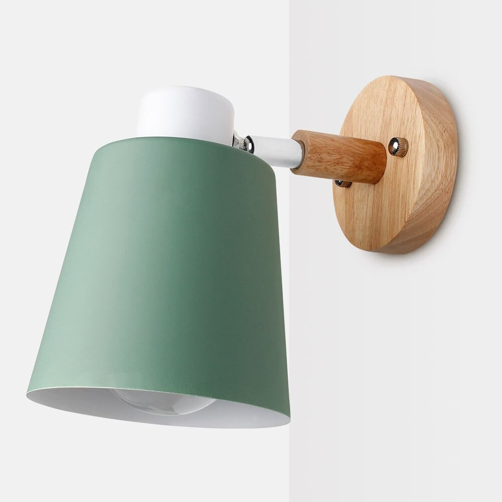 Soft downward lighting with matte green shade and adjustable arm for modern ambiance.