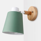 Soft downward lighting with matte green shade and adjustable arm for modern ambiance.